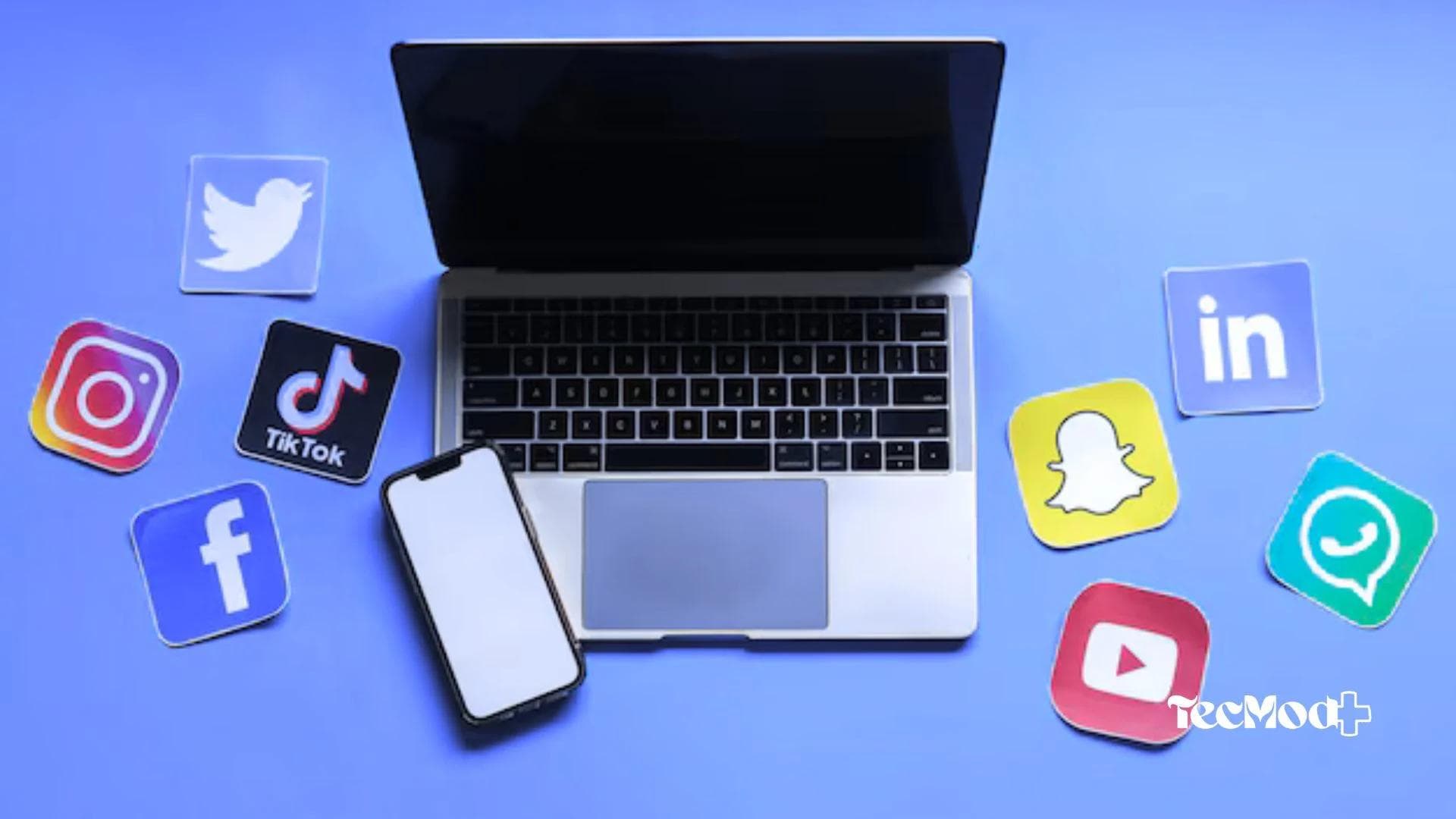 Smartphone e notebook com icones das redes sociais mais populares ao redor